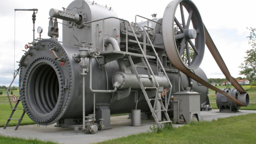 Egy gőzgép, amely hőenergiát mechanikai munkává alakít át, ipari környezetben.