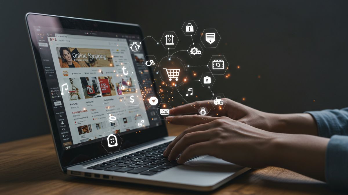 Egy fiatal ember laptopon böngészik online vásárlási lehetőségeket, digitális ikonokkal körülvéve.