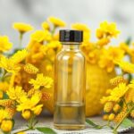 Aranyvessző kivonat üvegpalack virágokkal díszítve