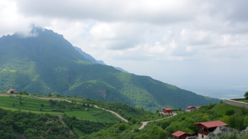 Gyönyörű hegyvidéki táj zöldellő dombokkal és házakkal.